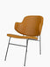 A side-angle view of The Penguin Lounge Chair, fully upholstered in tan leather with a dark powder-coated steel frame.