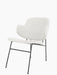 The Penguin Lounge Chair, fully upholstered in light grey textured fabric, shown at an angle on its thin black metal frame.