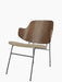 A Penguin Lounge Chair with a curved walnut veneer back and an Audo Bouclé 02 upholstered seat on a slim steel frame.