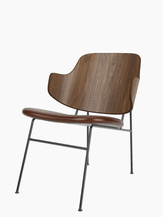 A Penguin Lounge Chair with a curved walnut veneer backrest, a brown upholstered seat, and a slim, black steel frame.