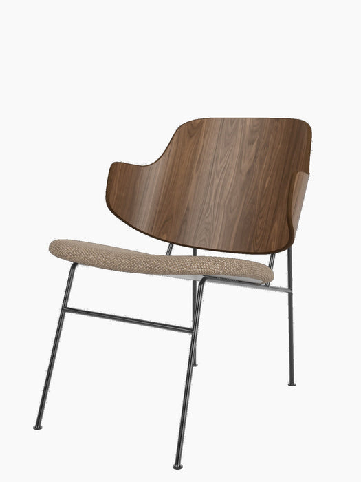 The Penguin Lounge Chair in walnut with a Logan Flint upholstered seat on a slender, powder-coated steel frame.