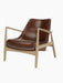 A Seal Lounge Chair, Low Back, with a sculpted natural oak frame and smooth, rich brown Dakar leather upholstery.