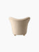 Back view of The Tired Man Lounge Chair in a light textured textile, showing its curved backrest and short wooden legs.