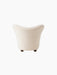 Back view of The Tired Man Lounge Chair. The chair has a high, curved back and is upholstered in a cream textured fabric.