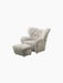 The Tired Man Ottoman, shown with the matching armchair. Both are upholstered in plush, green-tea coloured sheepskin.