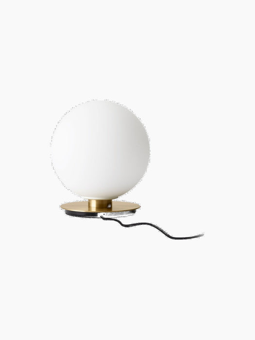 Rear view of the TR Bulb Ceiling/Wall Lamp, spherical opal glass shade on a circular brushed brass base with its black cord.