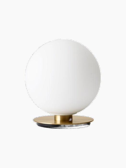 Front view of the TR Bulb Ceiling/Wall Lamp, showing a spherical white opal glass bulb sitting on a circular flat brass base.