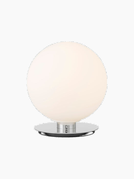 Front view of the TR Bulb Ceiling/Wall Lamp with its illuminated spherical opal glass shade on a polished steel base.