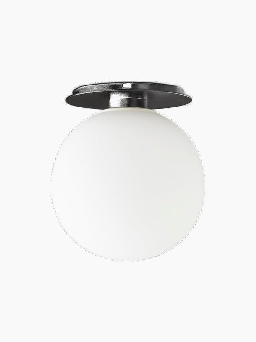 A TR Bulb, Ceiling/Wall Lamp with a black fixture and a large, spherical opal glass bulb, shown against a black background.
