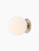 Angled view of TR Bulb, Ceiling/Wall Lamp. A large, glowing opal glass sphere is mounted on a polished steel circular base.