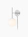 TR Bulb, Suspended Wall Lamp with a polished steel frame and a glowing white opal glass bulb, on a black background.