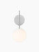 A TR Bulb, Suspended Wall Lamp in polished steel, front view, featuring a round wall plate and a glowing opal glass orb.