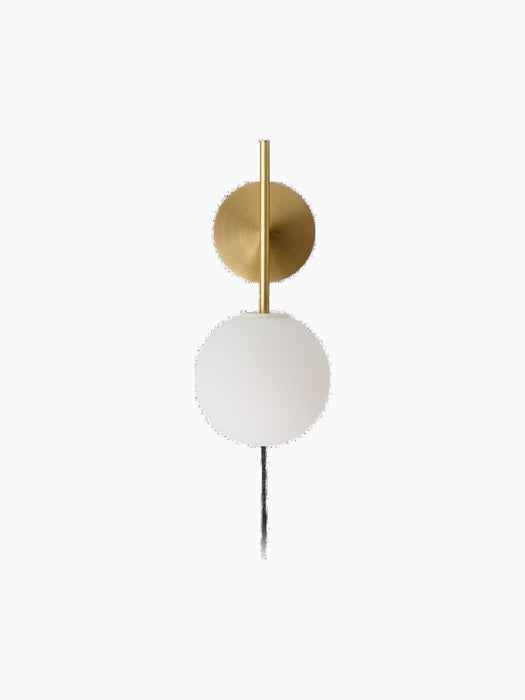 TR Bulb, Suspended Wall Lamp in brushed brass with a white opal glass bulb against a black background.