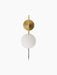 TR Bulb, Suspended Wall Lamp in brushed brass with a white opal glass bulb against a black background.
