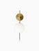 Front view of the TR Bulb, Suspended Wall Lamp in brushed brass with its illuminated, round white opal glass bulb.