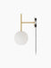 Side view of the TR Bulb, Suspended Wall Lamp with a brushed brass frame, white opal glass sphere, and black wall fixture.