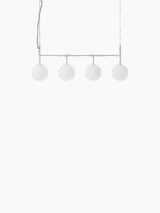 TR Bulb, Suspension Frame in polished steel with four spherical white opal glass bulbs against a black background.