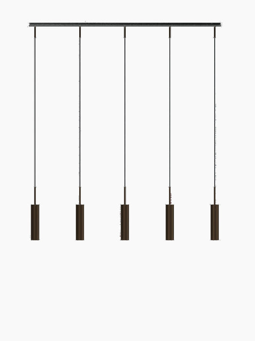 Tubulaire Rail Pendant 5, featuring a black rail with five hanging cylindrical pendants in reeded, bronzed brass aluminium.