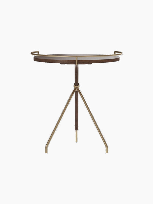 Back view of the Umanoff Side Table, with its round walnut top, brushed brass rail, and tripod-inspired frame.
