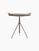 Back view of the Umanoff Side Table, with its round walnut top, brushed brass rail, and tripod-inspired frame.