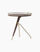 Angled view of the low Umanoff Side Table, featuring a solid walnut round top with a brushed brass rail and a tripod base.