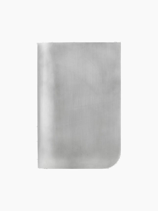 Front view of the Volume Side Table in polished, brushed aluminium, highlighting its modern, sculptural form.