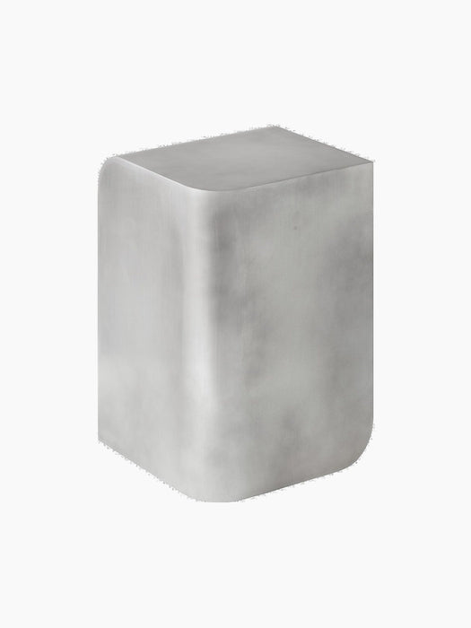 Angled view of the cube-shaped Volume Side Table in brushed aluminium with a polished sheen and soft, rounded corners.