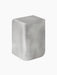 Angled view of the cube-shaped Volume Side Table in brushed aluminium with a polished sheen and soft, rounded corners.