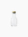 A 0.5L clear glass water bottle with a cylindrical neck and curved body, sealed with a polished brass lid on a black base.