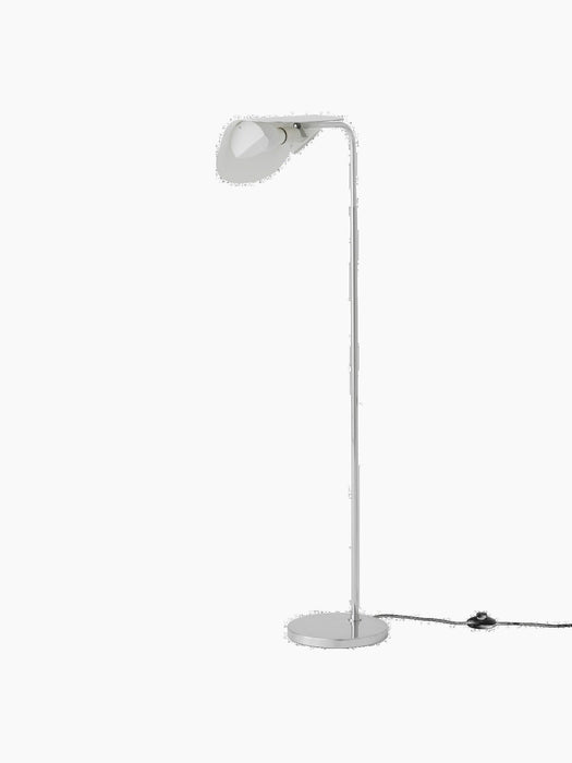 Angled view of the polished aluminium Wing Floor Lamp. The tall, minimal lamp features a round base and a wing-shaped shade.