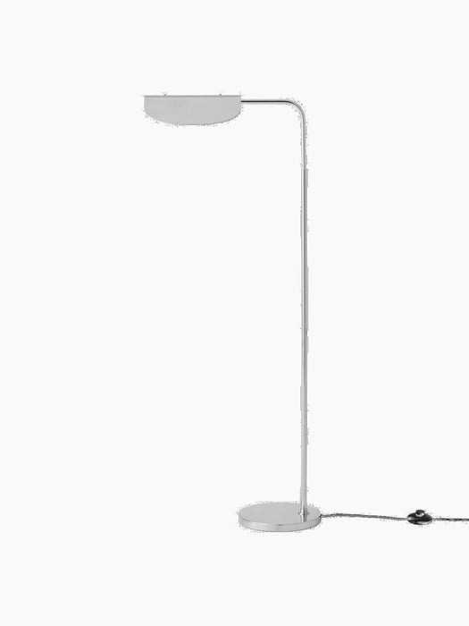 Side profile of the Wing Floor Lamp in polished aluminium. It features a slim stand, round base, and a wing-shaped shade.