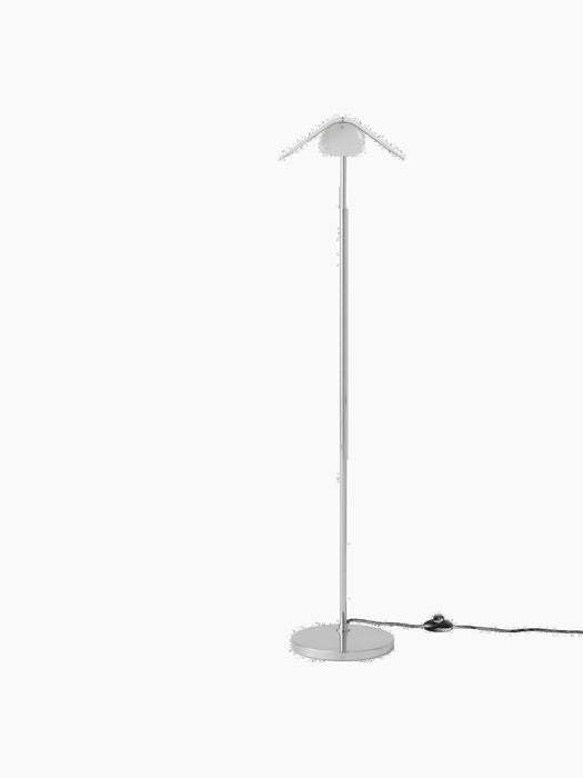 Front view of the Wing Floor Lamp in polished aluminium, with a slim stand, round base, and a wing-shaped shade.