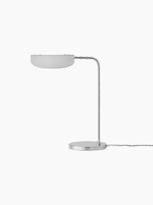 Side view of the Wing Table Lamp in polished aluminium with a circular base, slender L-shaped stem, and a wing-like shade.