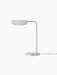 Side view of the Wing Table Lamp in polished aluminium with a circular base, slender L-shaped stem, and a wing-like shade.