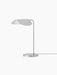 Side view of the Wing Table Lamp in polished aluminium with a wing-shaped shade, a slender stem and a circular base.