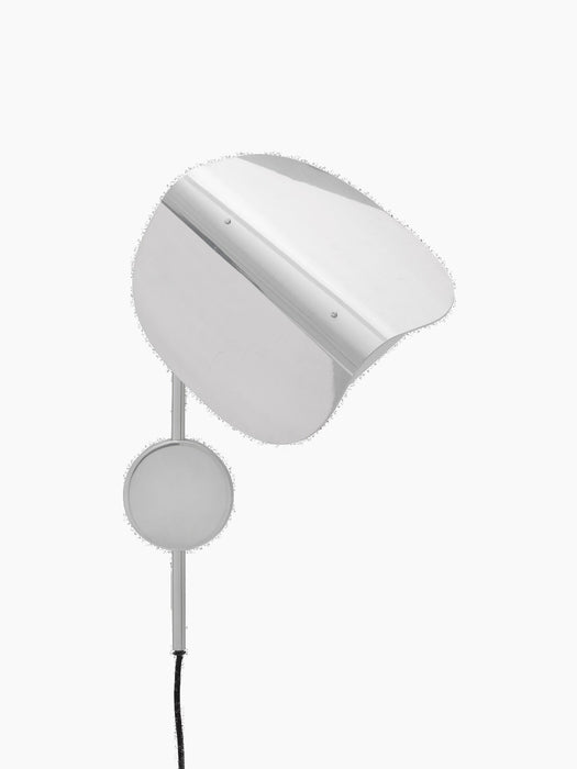 The Wing Wall Lamp in polished aluminium, shown from the front against a black background. The lamp is switched off.
