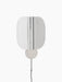 Front view of the Wing Wall Lamp in polished aluminium. The light is on, illuminating its folded, wing-like shade.