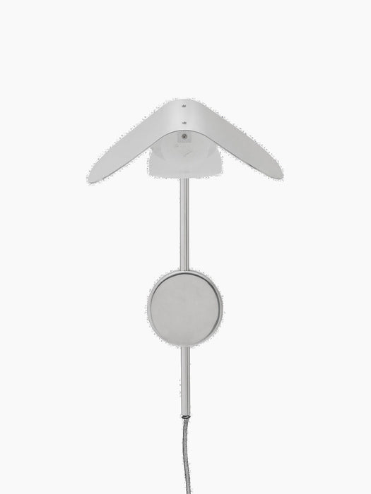 The Wing Wall Lamp in polished aluminium, shown from above, switched off, with a wing-shaped shade and round mount.