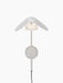 A front view of the illuminated Wing Wall Lamp in polished aluminium, featuring a wing-like shade over a glowing diffuser.