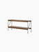 Angled view of the Zet Storage System. It has two dark stained oak shelves and a black steel frame with Z-shaped struts.