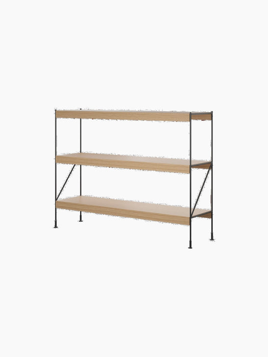 A Zet Storage System with a black steel frame and three natural oak shelves, viewed from an angle against a black background.