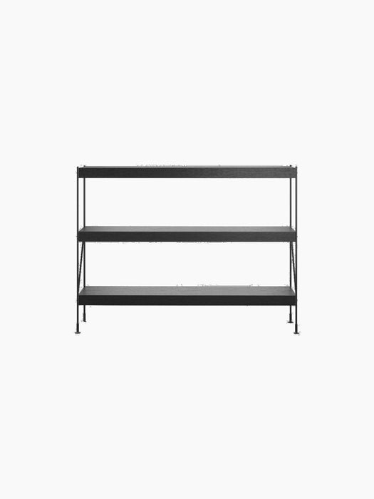 Front view of the Zet Storage System, a three-tiered shelving unit with black oak shelves and a thin black steel frame.