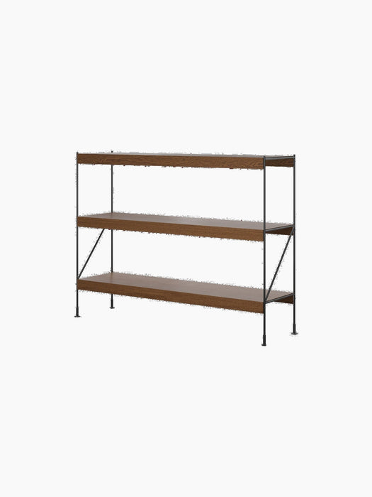 The Zet Storage System with a black steel frame and dark stained oak shelves, shown at an angle against a black background.
