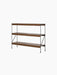 The Zet Storage System with a black steel frame and dark stained oak shelves, shown at an angle against a black background.