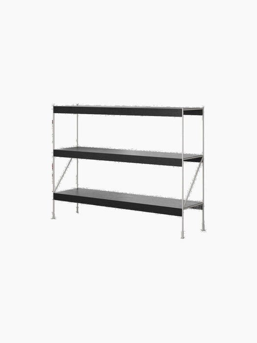 Angled view of the Zet Storage System, featuring three wide black oak shelves supported by a minimalist ivory steel frame.